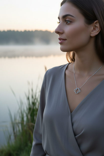 Model with clover pendant by lake