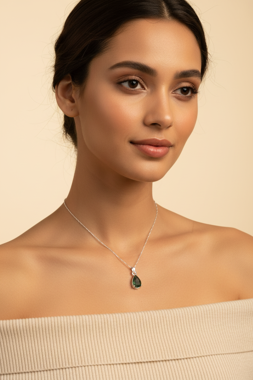 Model with moldavite pendant - cream background