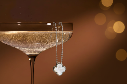 Mother-of-pearl clover pendant with champagne glass