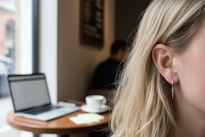 Silver hoop spike earrings - coffee shop, laptop, window light